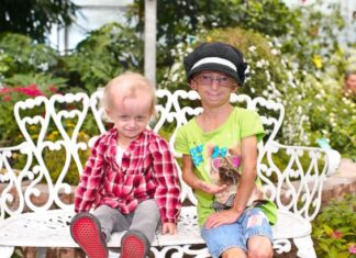 Families, community rally around girls with rare disease